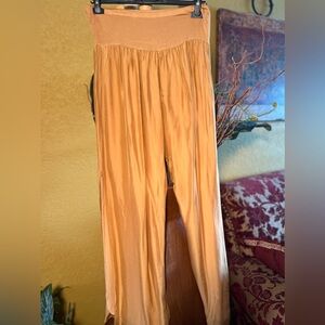 Silky Italian gold pant lined inside with slits on the sides.